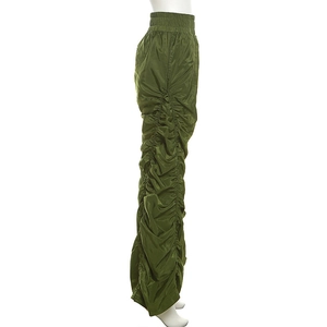 Detail of army green high waisted trousers with stacked ruched sides and elastic waistband