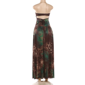 Close-up of halter chain detail and leopard print fabric on a backless maxi dress