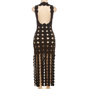Detail of the backless cutout design on a black geometric mesh maxi dress for women