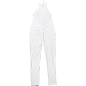 Detailed view of backless halter neckline and ruched texture on white jumpsuit