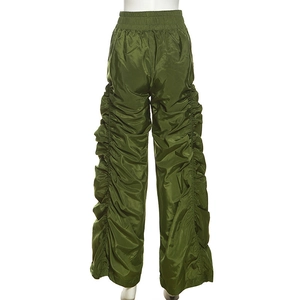 Detail of olive green high-waisted wide leg trousers with side drawstring ruching details
