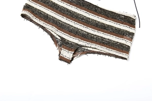 Macro shot of striped knit bikini bottom with a fuzzy textured weave and raw edge detail