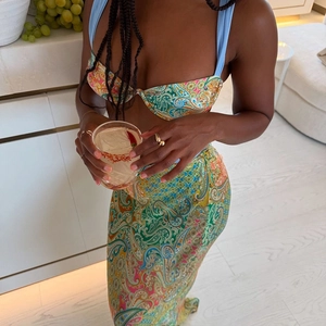 Detail of three-piece paisley print bikini top and high waisted maxi skirt set