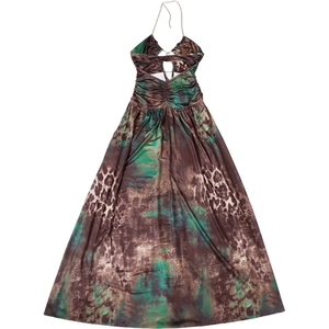 Detail view of the halter neck chain and vibrant green animal print maxi dress fabric