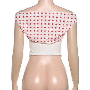 Detail of white one-shoulder crop top with red and white polka dot ruffle trim at the back