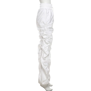 Detail of white high-waisted stacked jogger pants with side ruching and elastic waist