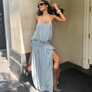 Detail of light blue mesh slip dress featuring waist ruching and a high side slit design