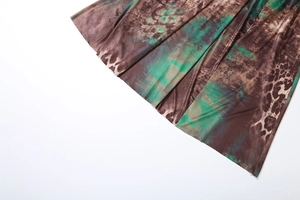 Detail of tie-dye and leopard print fabric with silky texture and quality hem stitching