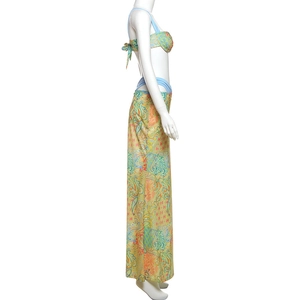 Detail of bohemian paisley print on high-waist maxi skirt and strapless bikini top
