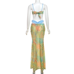 Back view of paisley print three-piece swimwear with a long mermaid beach skirt