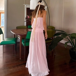 Detail of light pink slit mesh dress featuring elegant draping and romantic lace hair ribbon