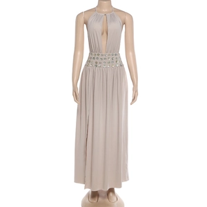Detail of sequin waist trim on a sexy khaki halter neck maxi dress with high slit