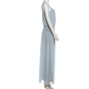 Close-up of light blue mesh fabric with elegant high-waisted pleats and slit detail