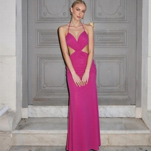 Close-up of rose red halter maxi dress featuring V-neck cross design and side cut-outs
