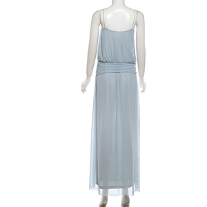 Macro detail of the elegant light grey blue mesh dress showing ruched waist and slit design