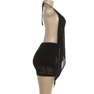 Detail of black halter backless top with draped front and ruched mini skirt on mannequin
