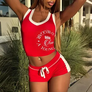 Detail of red and white two-piece athletic set with V-neck top and drawstring shorts