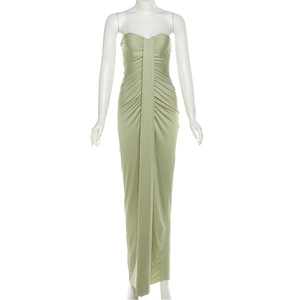 Close-up of sage green satin midi dress featuring elegant ruched pleats and a central strap
