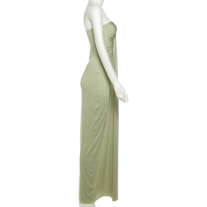 Detail of ruched side seams on a slim-fit sage green tube dress with soft drape