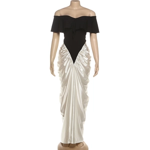 Detailed V-shaped waist seam and pleated drape of the black and white evening dress