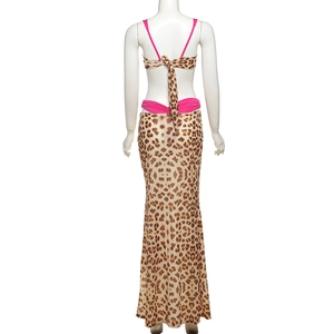 Detail view of pink trim and leopard print skirt back on this three-piece swimwear set