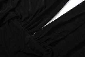 Macro detail of sexy deep V-neck mesh dress showing ribbed fabric and reinforced stitching