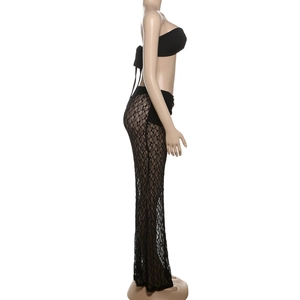 Detail of sexy black lace two-piece set featuring sheer floral texture and tie-up bandeau