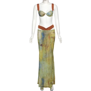 Detail view of abstract oil painting print on bikini top and long fishtail skirt