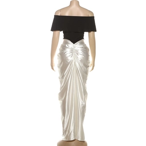 Rear view of an elegant off-shoulder black top and white satin maxi skirt with ruched detail