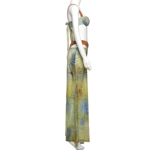 Detailed side view of abstract oil painting print bikini with mesh wrap skirt on a mannequin