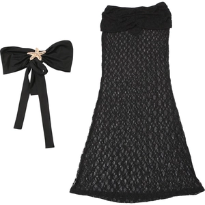 Detailed view of black lace tube dress with starfish bow accessory for summer style