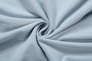 Close-up of light blue fine mesh fabric with breathable hole structure and soft drape