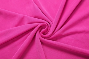 Detail of fuchsia mesh fabric showing breathable texture and spiral draping effect
