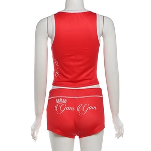 Rear view detail of red high-waist shorts featuring crown logo and contrast piping trim