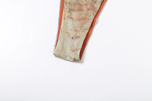 Detailed close-up of high-stretch swimsuit fabric with abstract print and orange piping