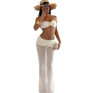 Two-piece white lace beach set with starfish bandeau top and hollow maxi skirt