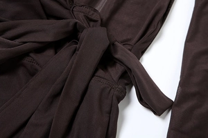 Close-up of dark brown mesh fabric and lace-up strap details on sexy bodycon dress