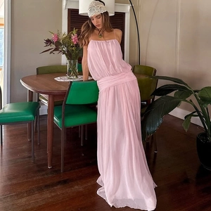Elegant pink maxi slit dress with mesh thin straps and gathered waist in vintage setting