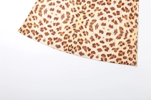 Detail showing high-quality stitching on leopard print skirt hemline fabric texture