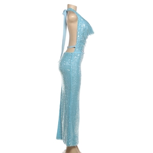 Detail view of light blue sequins on an open-back maxi dress with halter neckline