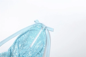 Detail of light blue sequined cocktail dress showing halter neck tie and ribbon detail
