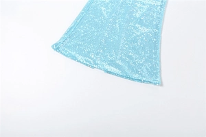 Detailed close-up of sky blue sequins on a slit dress with shimmering reflective texture