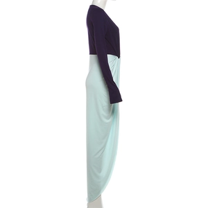 Detail of color-block dress with dark purple bodice and mint green draped slit skirt