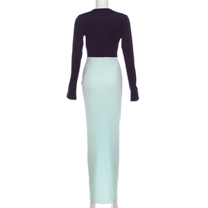 Rear view of a modern two-tone maxi dress with purple long sleeves and a mint green skirt