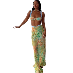 Three-piece vibrant paisley crop top and high-waist maxi skirt set for summer beachwear