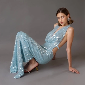 Elegant light blue sequined backless maxi dress with side cutouts and high slit for evening wear