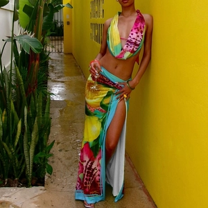 Detail of tropical floral print halter top and high slit maxi skirt two-piece set