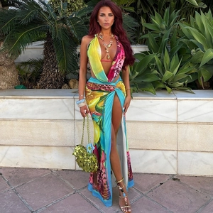 Detail of tropical lemon print halter top and high slit skirt set in smooth fabric