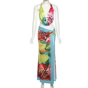 Detailed view of the high slit design and tropical print on this summer maxi skirt