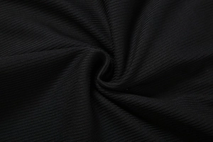Close-up of black ribbed knit fabric showing soft texture and vertical stripe detail